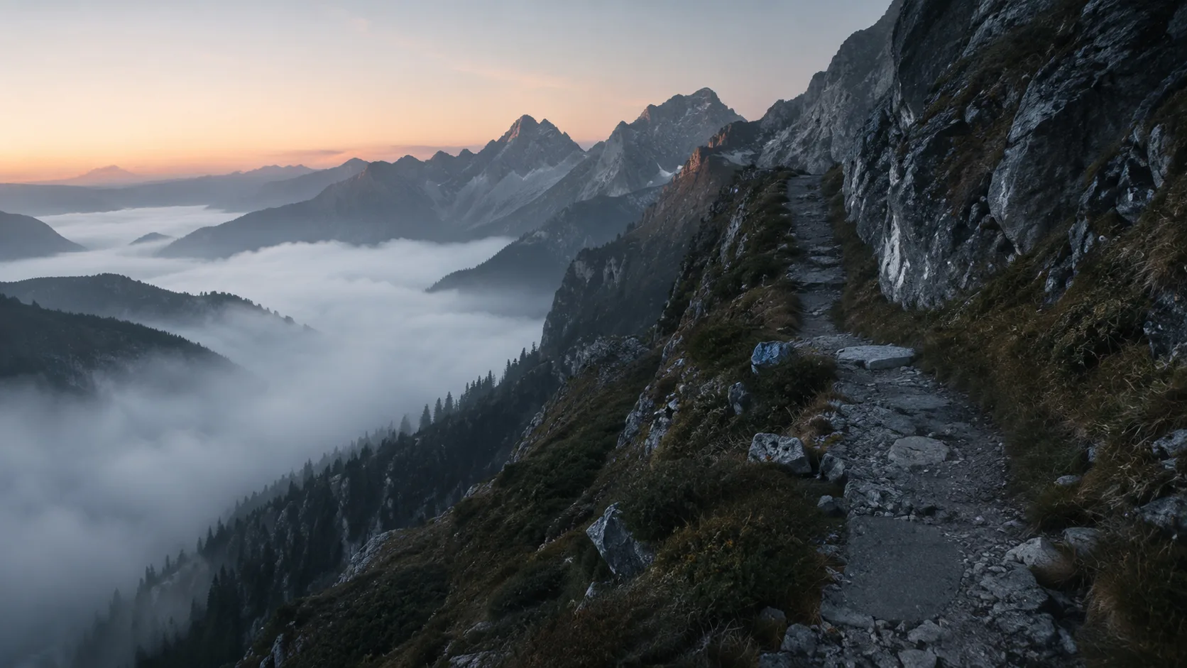 A narrow mountain ledge route above low cloud